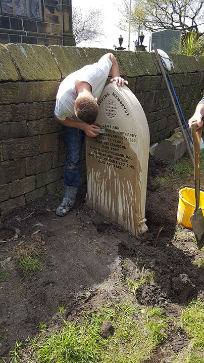 The stone was restored on site and as requested by our client we continued with the tradition and hand cut and blacked the lettering. Our stone mason can be seen here refinishing certain detail areas.